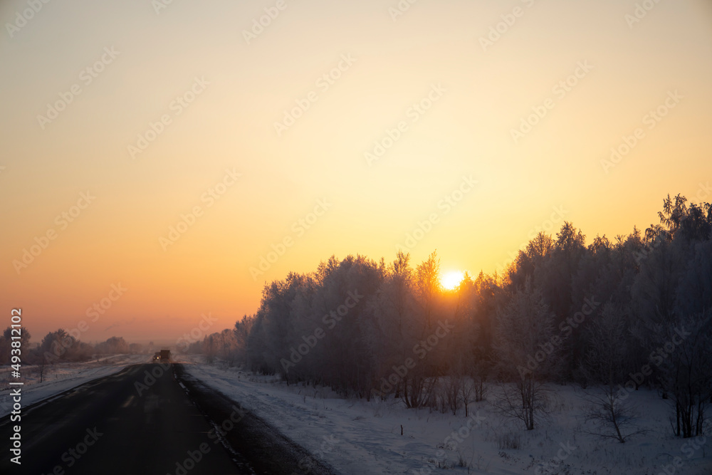 Winter road at sunrise, roads of Kazakhstan.