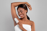 Beautiful Young African American Woman Touching Her Armpit With Feather