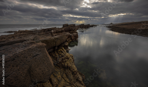 light rays over the coast at dusk in the East Neuk of Fife, Scotland