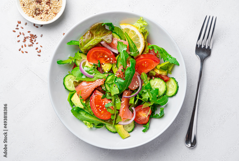 Vegetable salad with salmon, fresh herbs and sesame and flax seeds. Vegetable salad with salmon, fresh herbs and sesame and flax seeds.