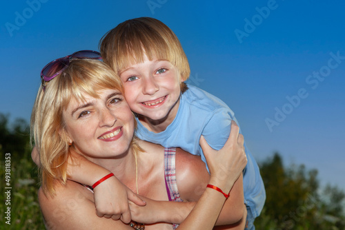 portrait mother with son outdoors