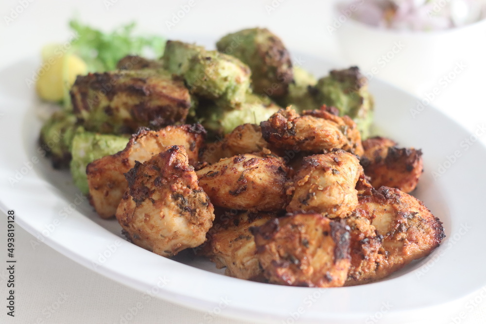 Green and red chicken kababs. Boneless chicken cubes marinated and air fried Green and red chicken kababs. Boneless chicken cubes marinated and air fried