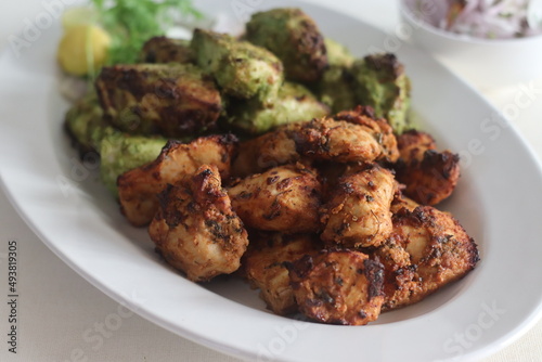 Green and red chicken kababs. Boneless chicken cubes marinated and air fried