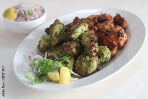 Green and red chicken kababs. Boneless chicken cubes marinated and air fried photo