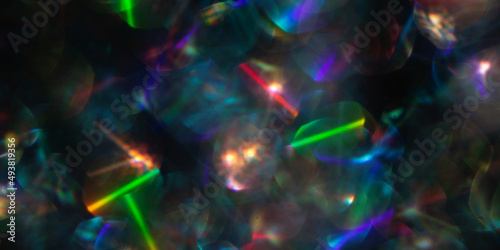 Abstract defocused black background with shining glitter.Good as overlay layer.Large banner.