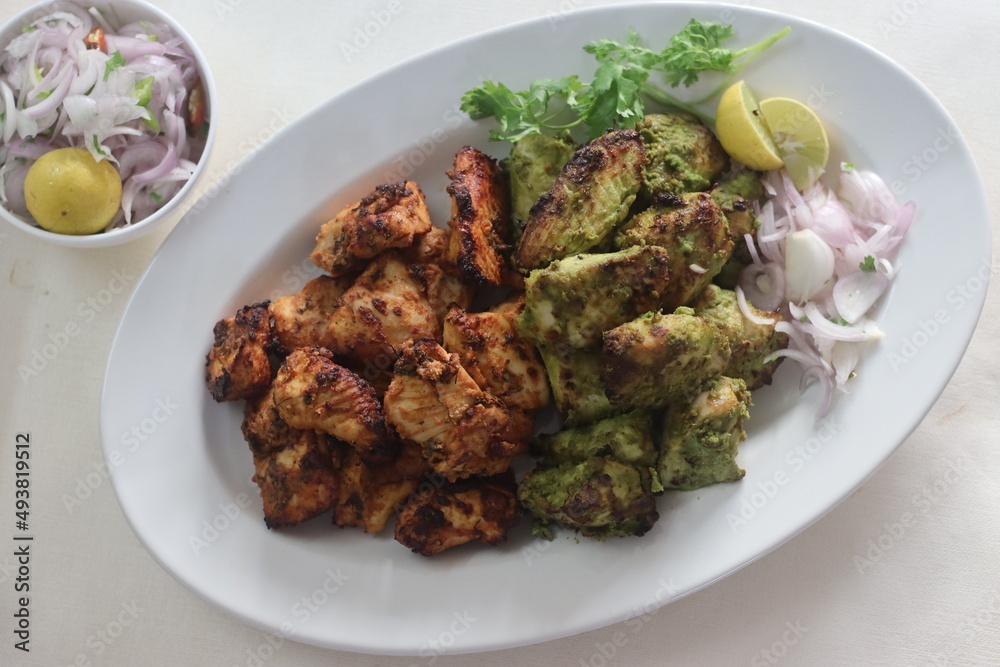 Green and red chicken kababs. Boneless chicken cubes marinated and air fried Green and red chicken kababs. Boneless chicken cubes marinated and air fried