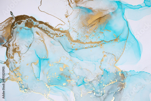 Luxurious abstract fluid painting in alcohol ink technique, mixture of blue and gold paints. Imitation of marble stone, © BestForYou