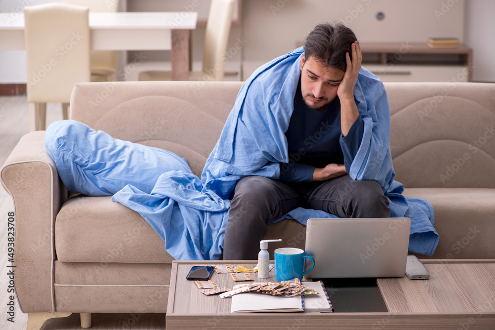 Young man feeling bad at home Young man feeling bad at home