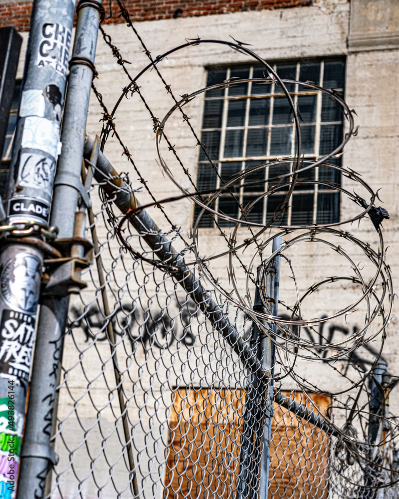 Grungy gritty downtown urban fence and barbed wire los angeles california