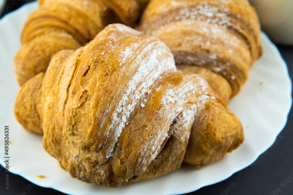 croissants on a white plate croissants on a white plate