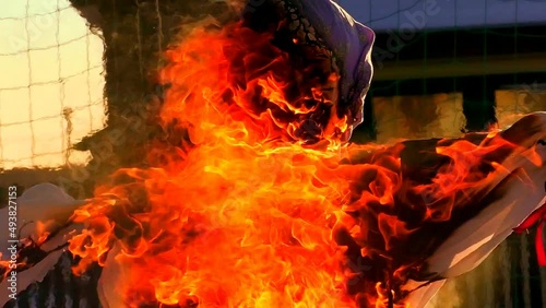 Scarecrow woman is on fire. The effigy at the Shrovetide festival is burning. photo