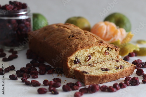Sliced Orange cranberry bread loaf. An orange flavoured quick bread with dried cranberries. A perfect accompaniment to coffee.