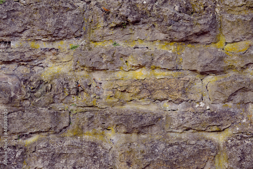 Obraz premium Texture of a stone wall. Old castle stone wall texture background. Stone wall as a background or texture. Part of a stone wall, for background or texture