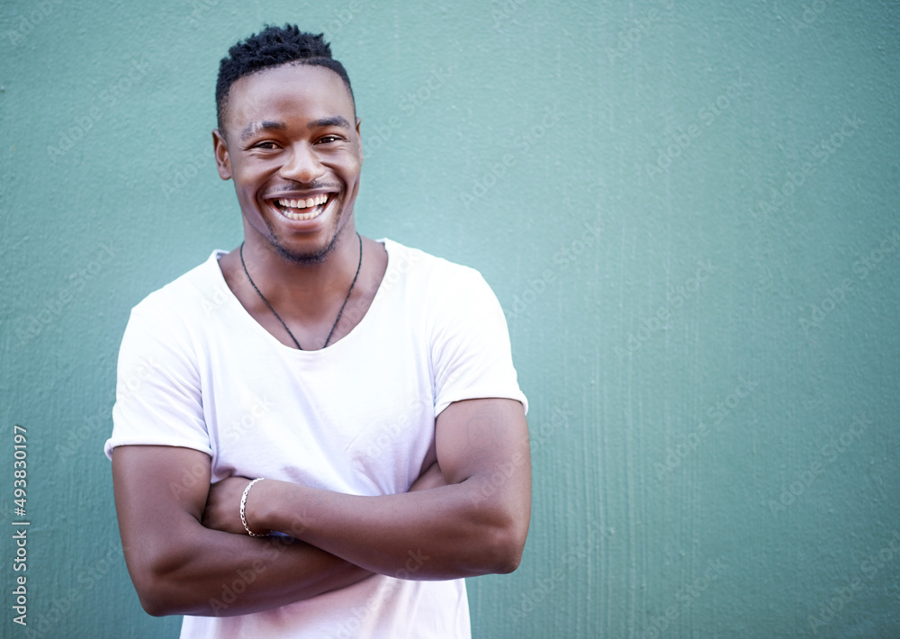 Lets always meet each other with a smile. Shot of a handsome young man out in the city. Lets always meet each other with a smile. Shot of a handsome young man out in the city.