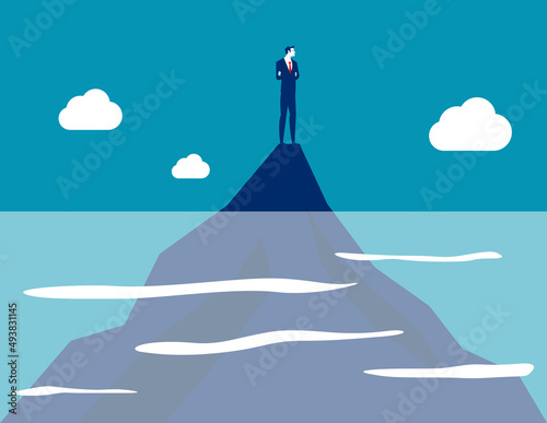 Business person on top mountain from part of the water