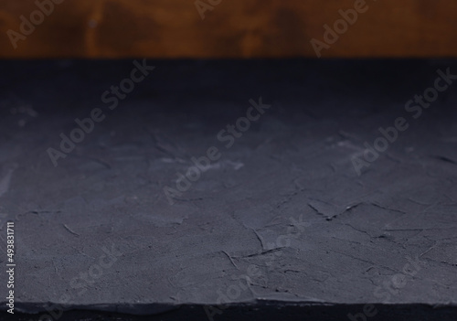 Abstraxt table top background texture.  Black stone tabletop front view photo