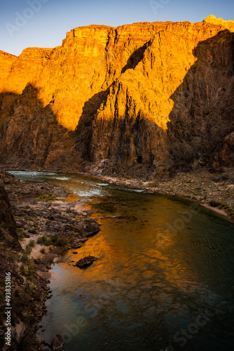 Bright Morning LIght Reflects In The Colorado River In The Grand Canyon
