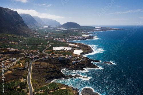 View from the height of a rocky cliff and the road along the island of Tenerife, Canary Islands, Spain photo