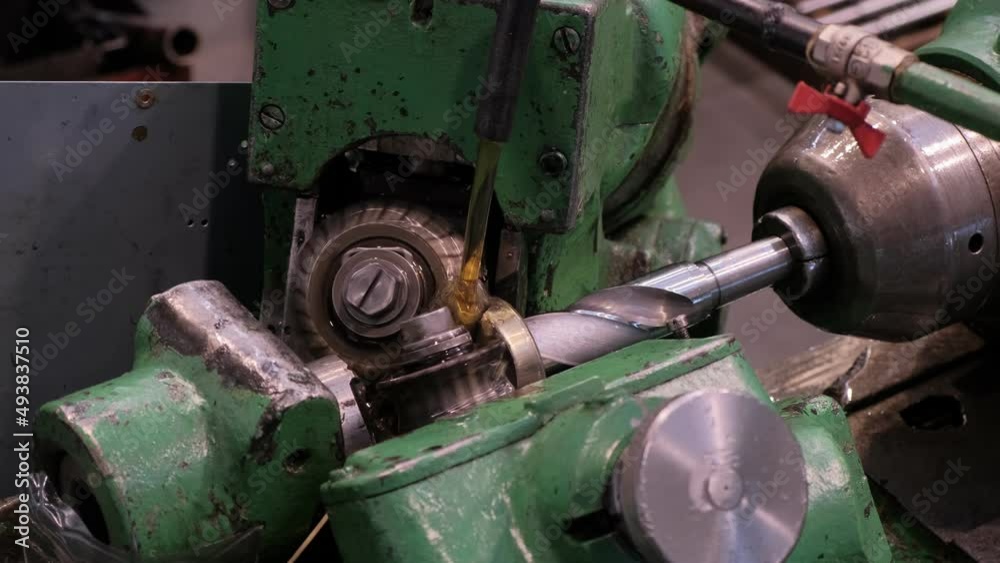 An industrial lathe processes metal. Tool manufacturing. Production of drills. An industrial lathe processes metal. Tool manufacturing. Production of drills.