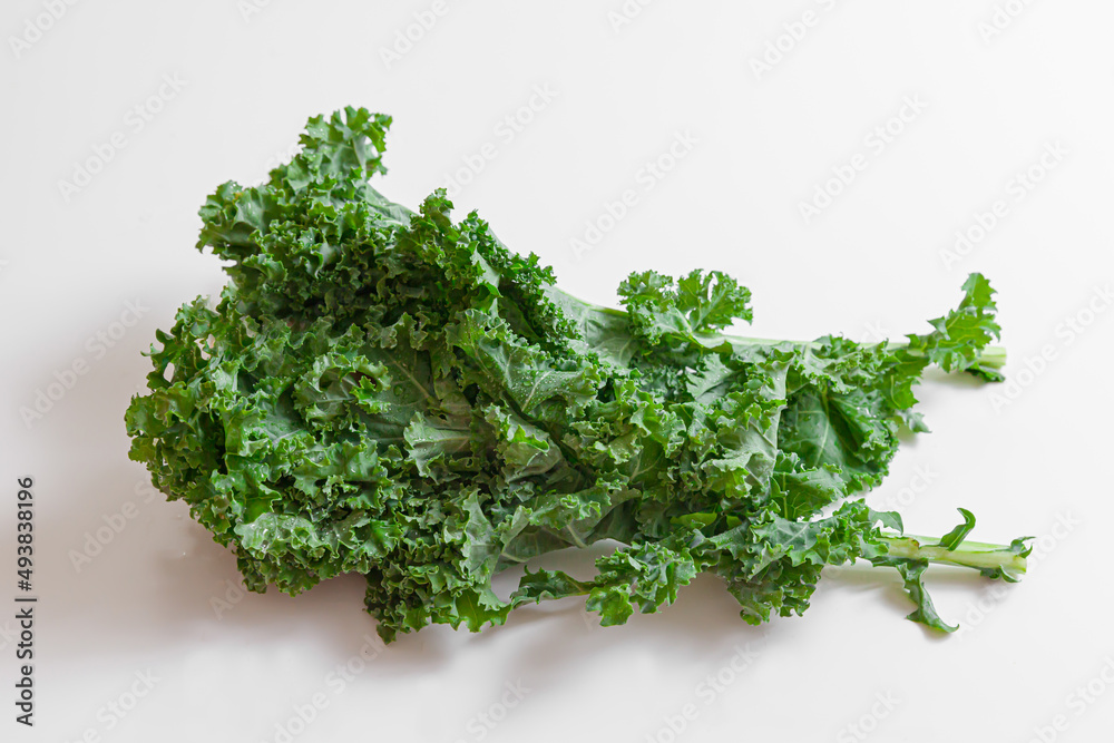 Curly kale leaves isolated on white background Curly kale leaves isolated on white background
