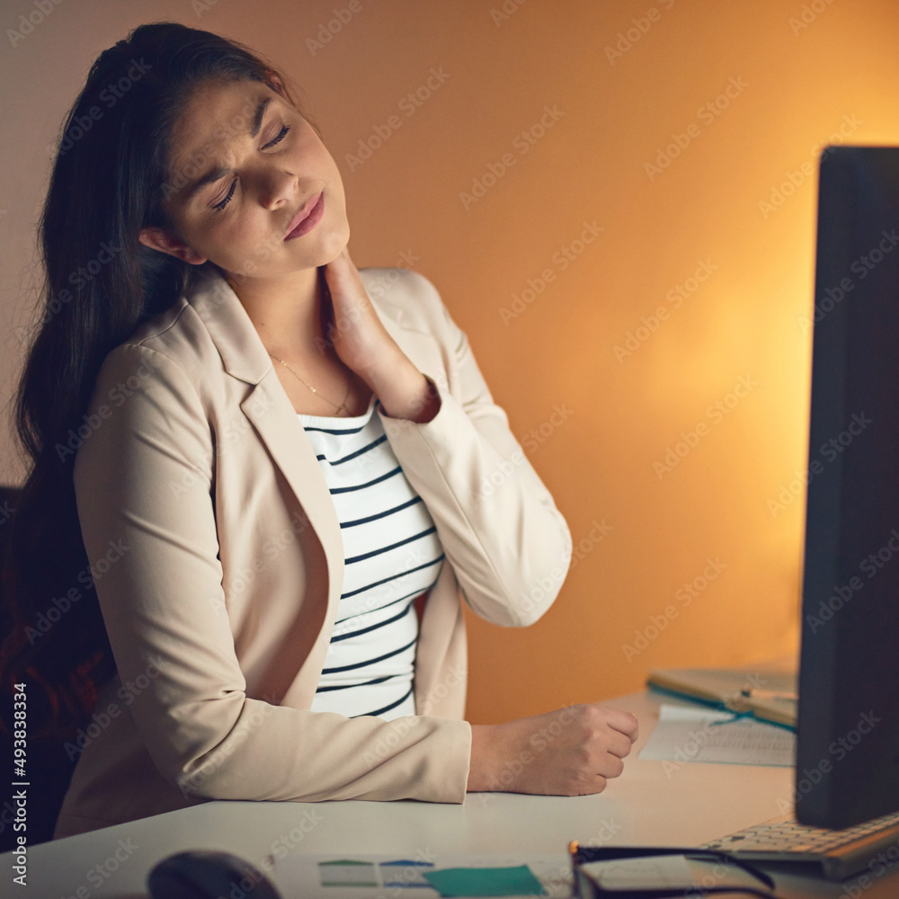 This is not what I signed on for. Shot of a young businesswoman experiencing strain during a late night at work.
