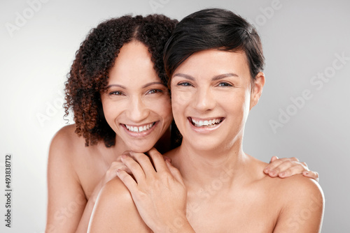 Beauty has more than one face. Cropped portrait of two beautiful mature women posing against a grey background in studio.