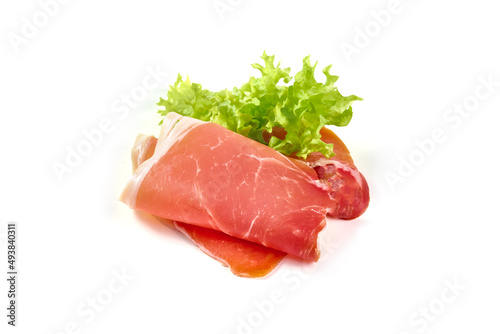 Spanish jamon iberico, serrano ham, isolated on white background. High resolution image.