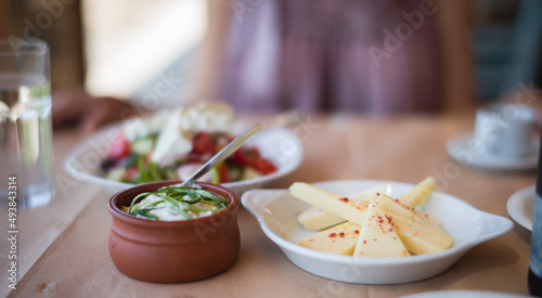 Fototapeta Naklejka Na Ścianę i Meble -  Restaurant in the mountains. Delicious local Greek cuisine, connect with nature and truly appreciate farm-to-table experience of being served with freshly prepared dishes using only local ingredients