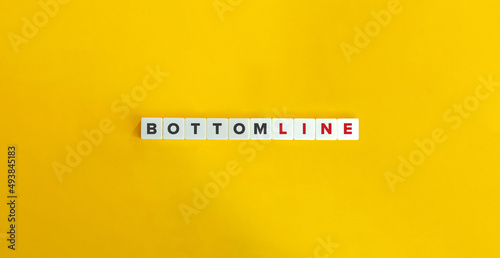 Bottom Line Phrase and Banner. Letter Tiles on Yellow Background. Minimal Aesthetics.