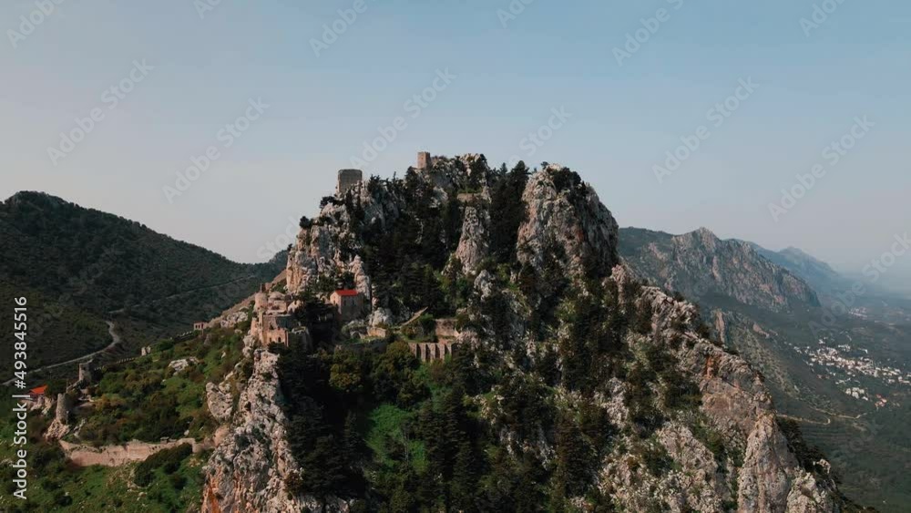 Aerial 4k Saint Hilarion Castle medieval building situated on top of mountain is surrounded with nature which has an amazing picturesque landscape of Mediterranean Sea in Kyrenia, North Cyprus Aerial 4k Saint Hilarion Castle medieval building situated on top of mountain is surrounded with nature which has an amazing picturesque landscape of Mediterranean Sea in Kyrenia, North Cyprus