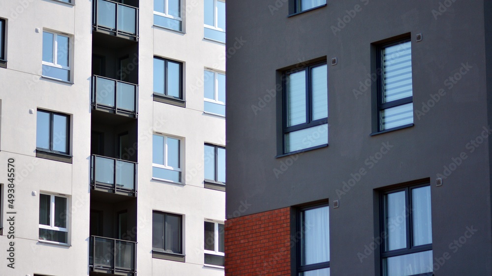 Modern european residential architecture on a sunny day. Exterior of new multi-story residential building. Concept of sale and rental of apartments for consumers .Modern windows and balconies. Modern european residential architecture on a sunny day. Exterior of new multi-story residential building. Concept of sale and rental of apartments for consumers .Modern windows and balconies.