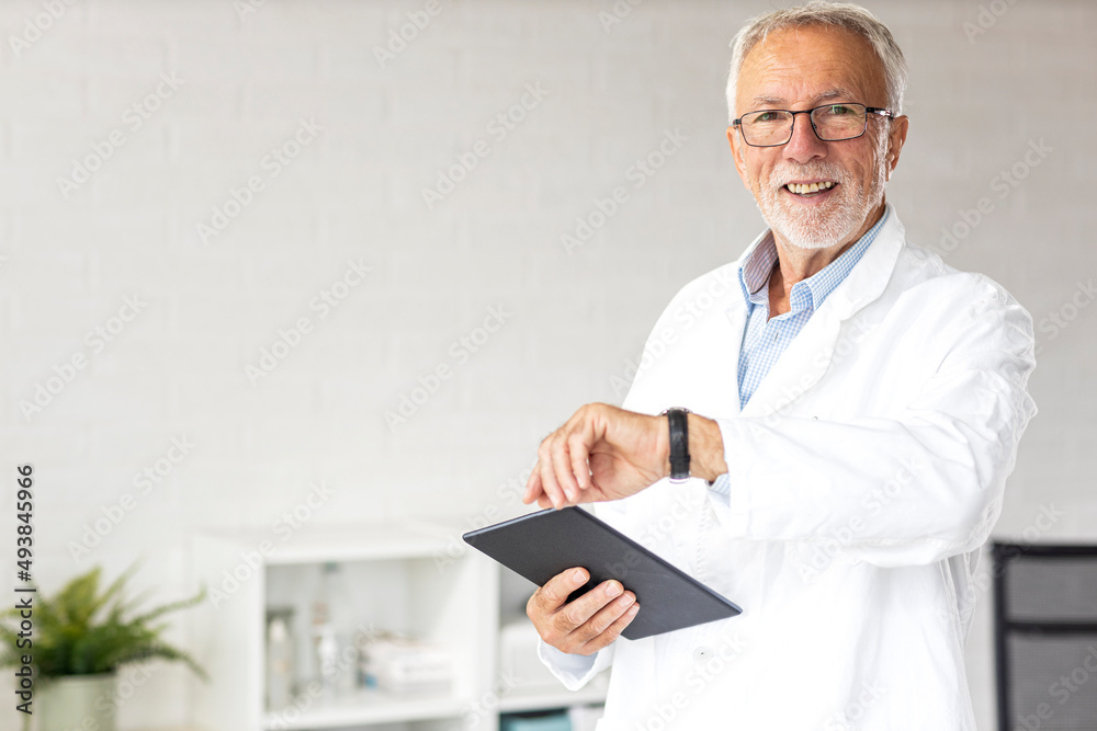 Portrait of doctor with tablet on hand and glasses on head at ambulance Portrait of doctor with tablet on hand and glasses on head at ambulance
