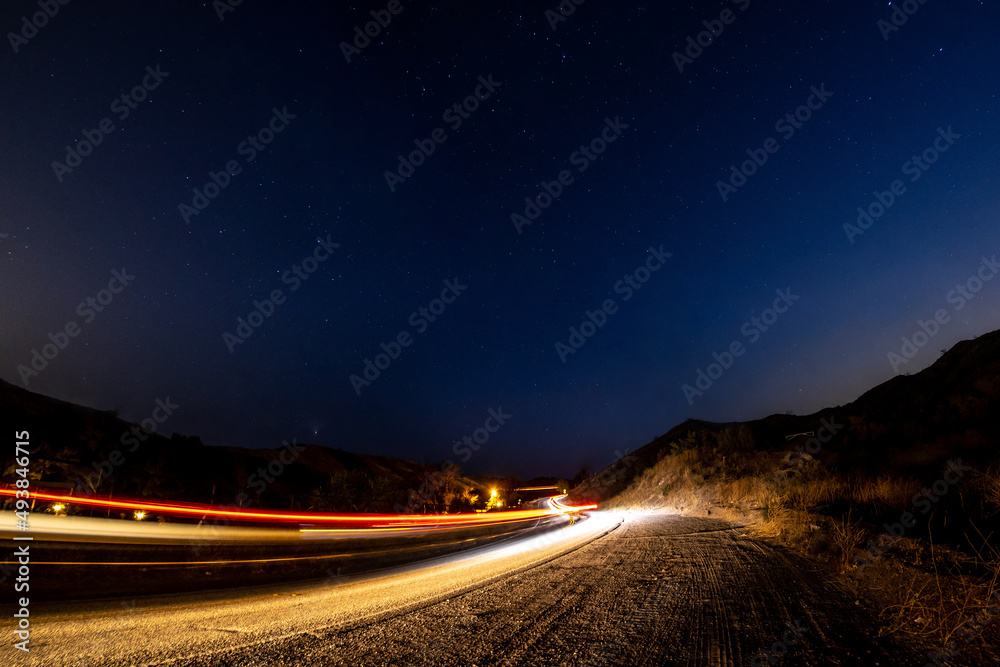 Car speeding down dark road