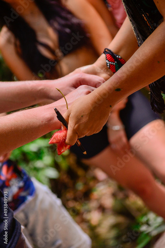 group holding hands in a moment of blessing in an indigenous ritual, international day of indigenous peoples, spins in Candomblé, Exu jira, Indian's day, indigenous ritual © liligluck
