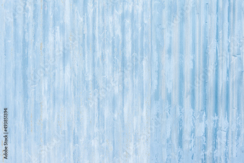 White corrugated metal fence background.