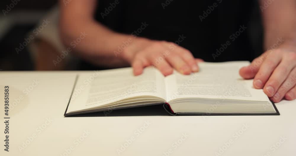 Book in a table in a room, man reading Book in a table in a room, man reading