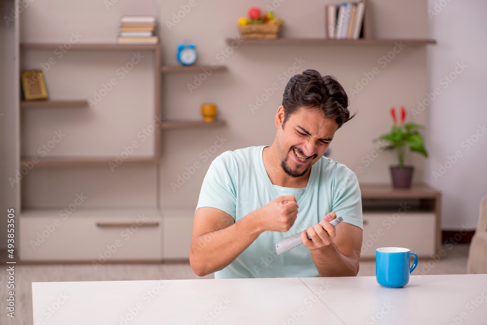 Young man watching tv at home Young man watching tv at home