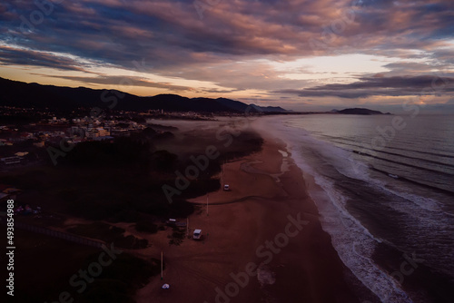 Campeche beach and ocean with sunrise or sunset in Florianopolis