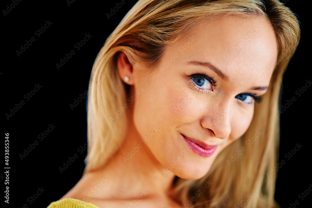 Stunningly beautiful. Closeup studio portrait of a beautiful young blonde woman on a black background. Stunningly beautiful. Closeup studio portrait of a beautiful young blonde woman on a black background.