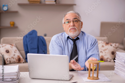 Old male boss working from home during pandemic