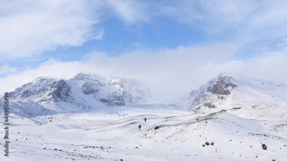 People exploring glacier landscape in Iceland at Kvíárjökull in winter. People exploring glacier landscape in Iceland at Kvíárjökull in winter.
