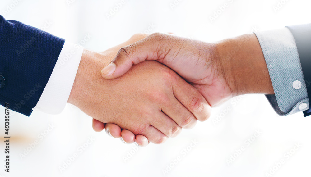 Strong partnerships are built on a strong foundation. Cropped shot of two businessmen shaking hands in a modern office. Strong partnerships are built on a strong foundation. Cropped shot of two businessmen shaking hands in a modern office.