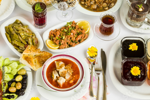 Traditional Turkish Ramadan Iftar,Dinner Table With Soup,red rose sherbet and Ramadan Bread.Beginning menu