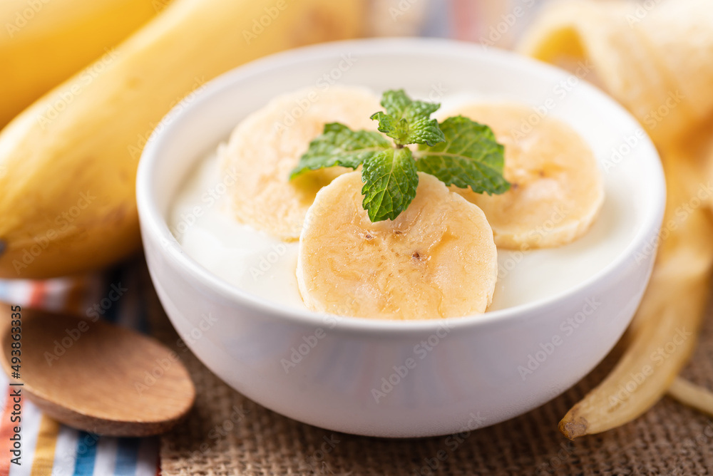 Yogurt with banana in bowl, Healthy eating Yogurt with banana in bowl, Healthy eating