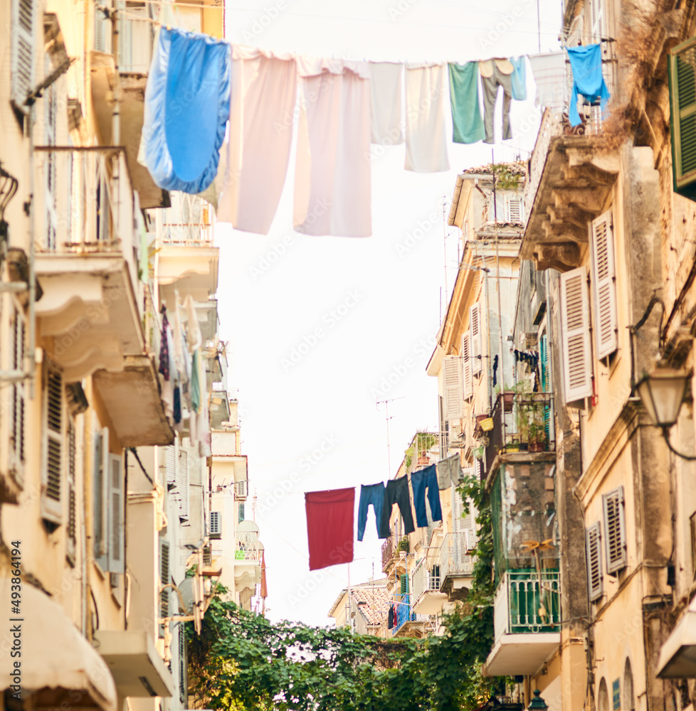 Its a different way of life. Low angle shot of clothing hanging from clothing lines between buildings in a foreign city. Its a different way of life. Low angle shot of clothing hanging from clothing lines between buildings in a foreign city.