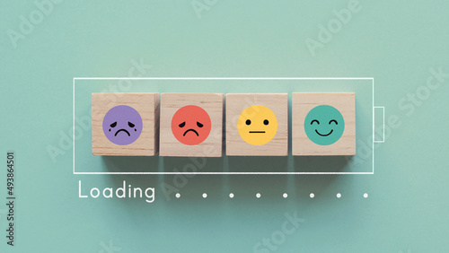 Emotion wooden blocks in loading bar ,mental health assessment, child wellness,world mental health day, think positive, compliment day concept