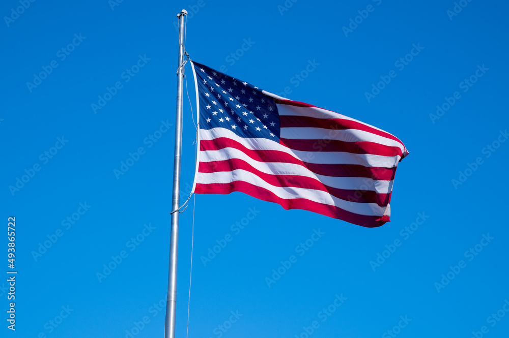 American flag against blue sky national patriotic red