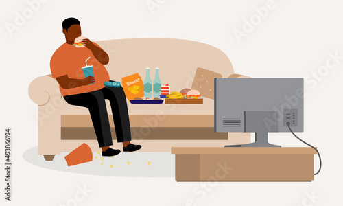 Fat Black Man Lying On Sofa While Watching TV And Eating Unhealthy Food. Binge Eating. Couch Potato.