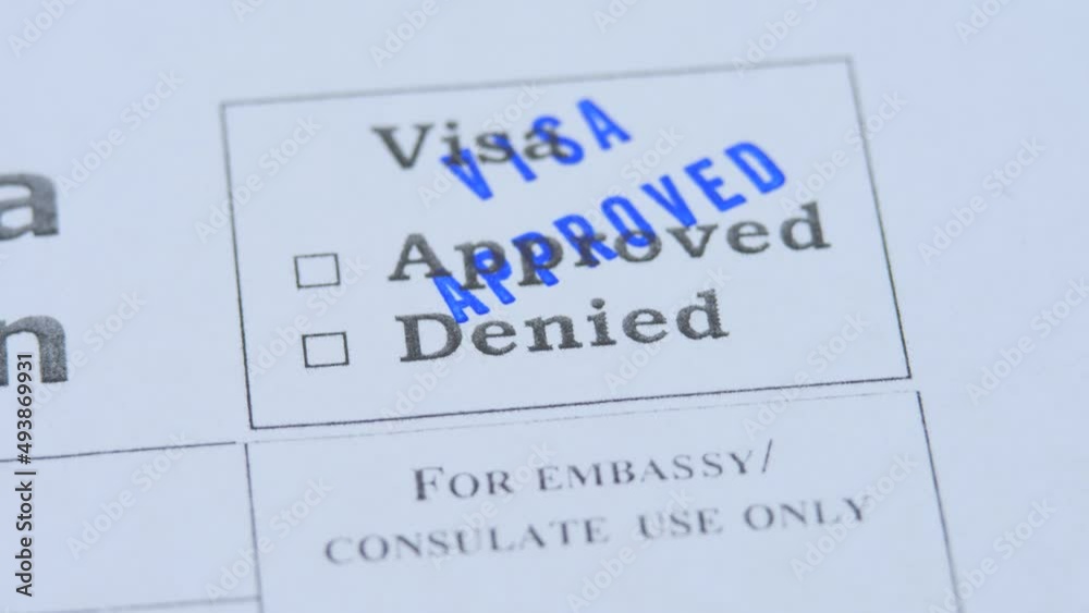 Stamping approved visa decision. Paper application form to travel or immigration. Embassy officer check document. Permission for foreigner country. Success interview. Emigration and immigration