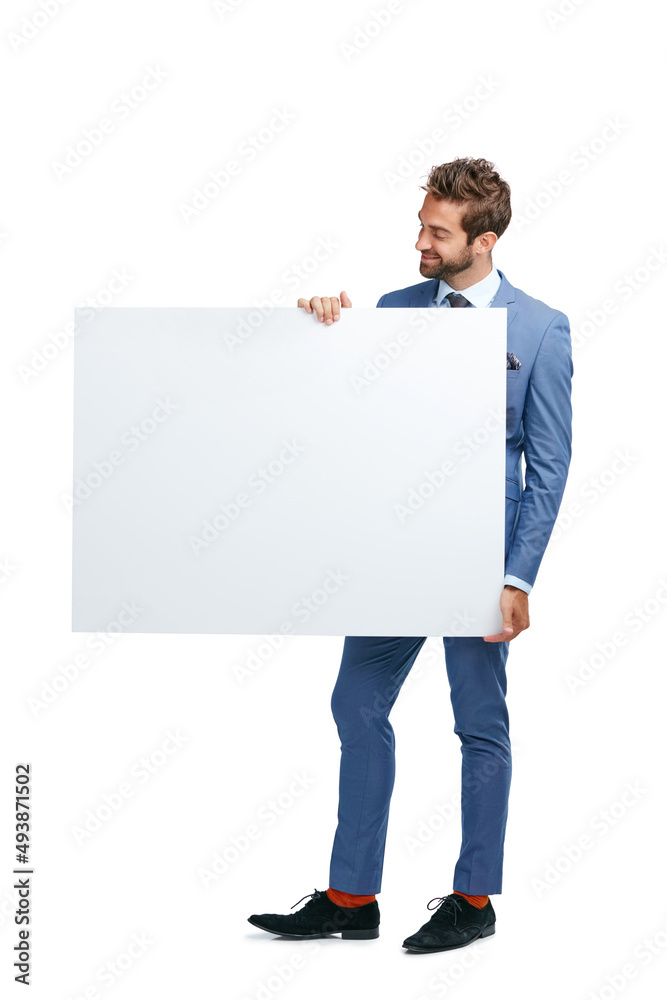 Stop everything youre doing and look at this. Studio shot of a handsome businessman holding up a blank placard against a white background. Stop everything youre doing and look at this. Studio shot of a handsome businessman holding up a blank placard against a white background.